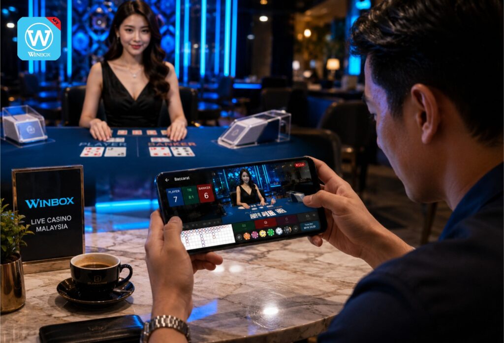 Malaysian man playing live baccarat on Winbox casino with real female dealer in premium casino studio